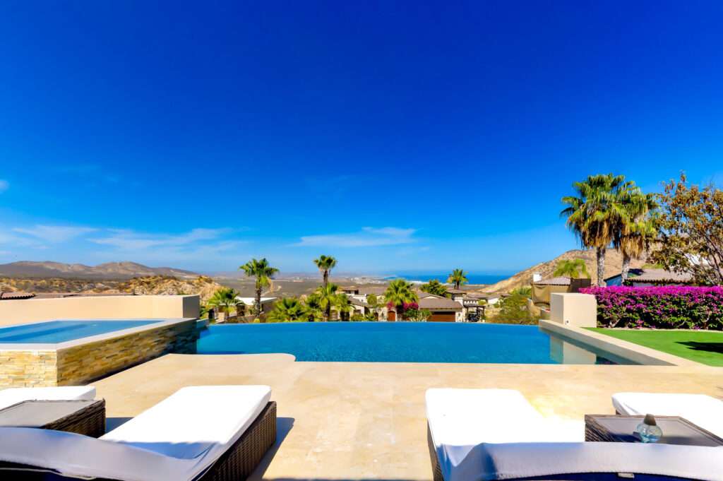 Cabo Luxury Section 4- Las Canadas Discover refined indoor-outdoor living at Cañada 9, set within Querencia, San Jose del Cabo's premier private golf community. Soaring beamed ceilings, walls of pocket glass, and luminous marble floors define an open great room that flows effortlessly to the terrace, infinity-edge pool, and stone-clad water feature -- all framed by panoramic Sea of Cortez and mountain – 140 Camino Pacifico Alto, Cabo San Lucas, BS