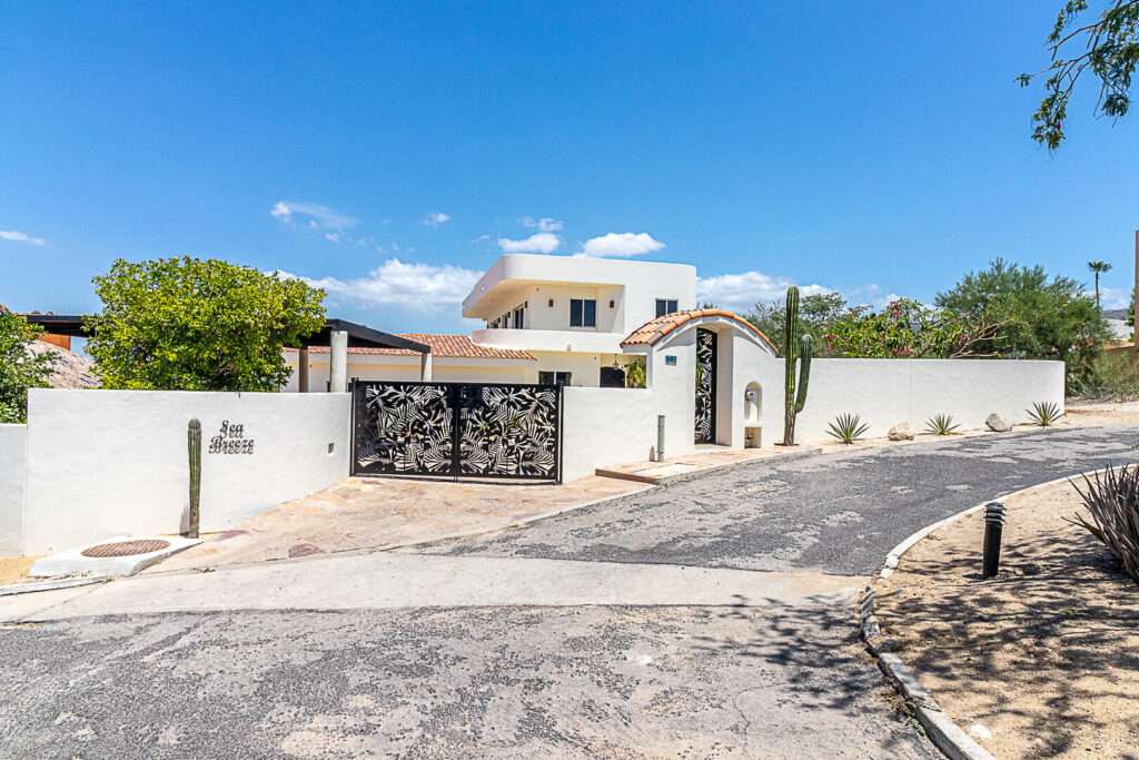 Cabo Luxury Las Tunas The Nacuii Residence is a refined luxury home crafted to exceed the expectations of even the most discerning buyer. Nestled on a generous and private 3,000 m² lot (0.73 acres), it's just a short, effortless stroll to the untouched, sandy shores of Las Tunas — perfect for enjoying the serene coastal landscape and dramatic sunsets. The home offers a thoughtful layout with 3 spacious bedrooms, a separate studio, a cozy TV lounge, and 6 full bathrooms, including two principal suites, a guest room, a detached studio, and a dedicated media or family room. Expansive sliding glass doors invite natural light throughout the interiors while showcasing tranquil garden for sale