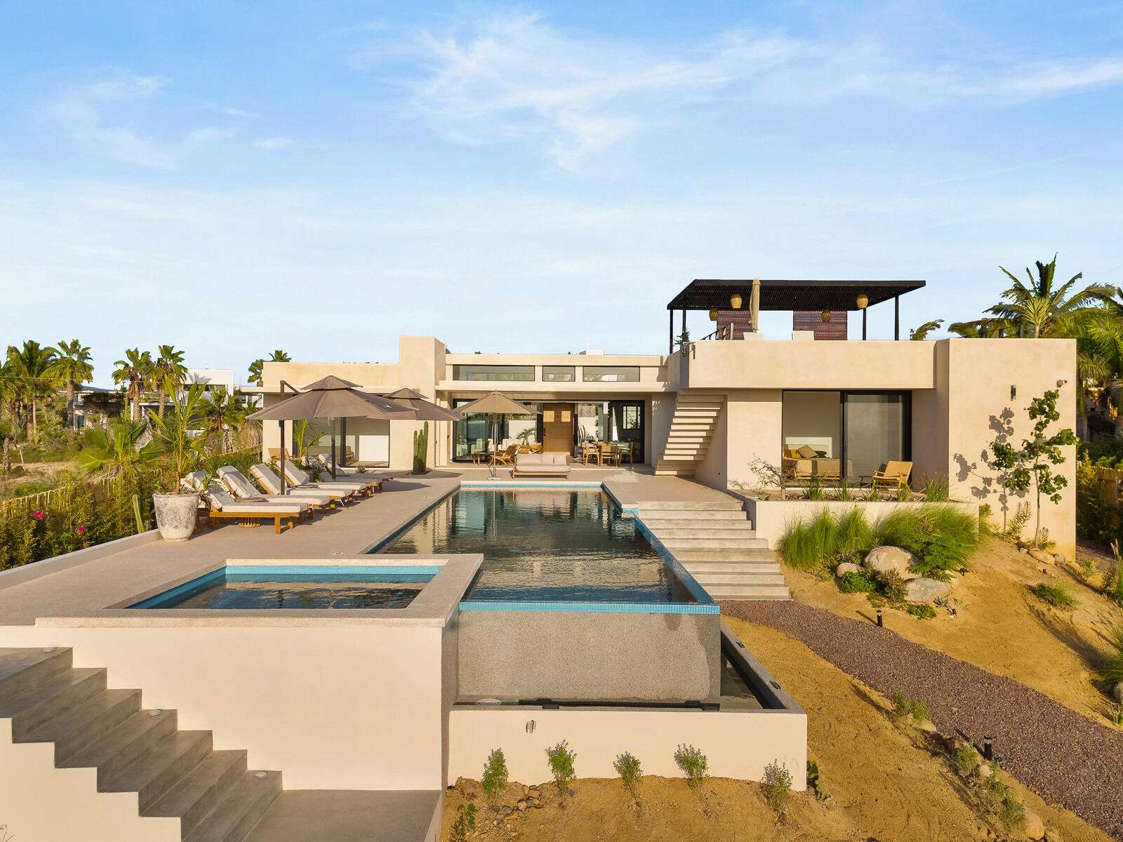 Cabo Luxury Elias Calles ---Beach Front Hacienda Estate---A rare Baja find, this seven-bedroom beachfront estate spans 2.47 acres with 164 feet (50 lineal meters) of white sandy beach! Enjoy whale watching from your private terrace overlooking the Pacific Ocean. The two main beach houses open up to the beach area and you can hear the waves crashing! The property features multiple residences, including two main beach houses that open directly to the sand, offering the sound of crashing waves and sharing a large social terrace perfect for Pacific sunsets. A third ''pool house'' with multiple rooms overlooks the pool area, ideal for guests. This estate presents significant potential, including converting into a Beachfront Boutique Hotel. Inquire for a brochure and FAQ. More information about Hacienda Las OlasTotal of 7 bedrooms, 4 full baths and 1 half bathThe Main Beach House has 1 master bed, 1 master bath complete with ocean for sale
