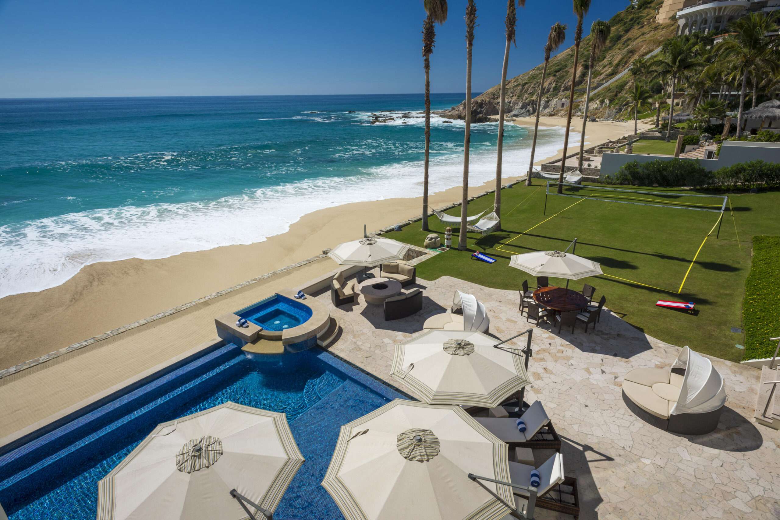 Cabo Luxury Section 18- Horizontes A stunning entry flanked on both sides by art display walls sets the tone for this contemporary masterpiece located in the Private Golf and Beach community of Querencia. Thoughtful architecture helps create a seamless transition from indoor to outdoor spaces complete with a resort style pool, lush landscaping, fire pit plus double sided fireplace, outdoor bar and full pool bath with shower. This beautifully furnished home has 4 bedrooms,6.5 baths which includes a one of a kind master-bedroom suite with his and her baths and a designers dream closet that could easily convert back to the original 5 bedroom floor plan. Completed in 2023, this almost new smart home features the latest technology and top of the line appliances, plus a full house solar system and hurricane shutters. for sale