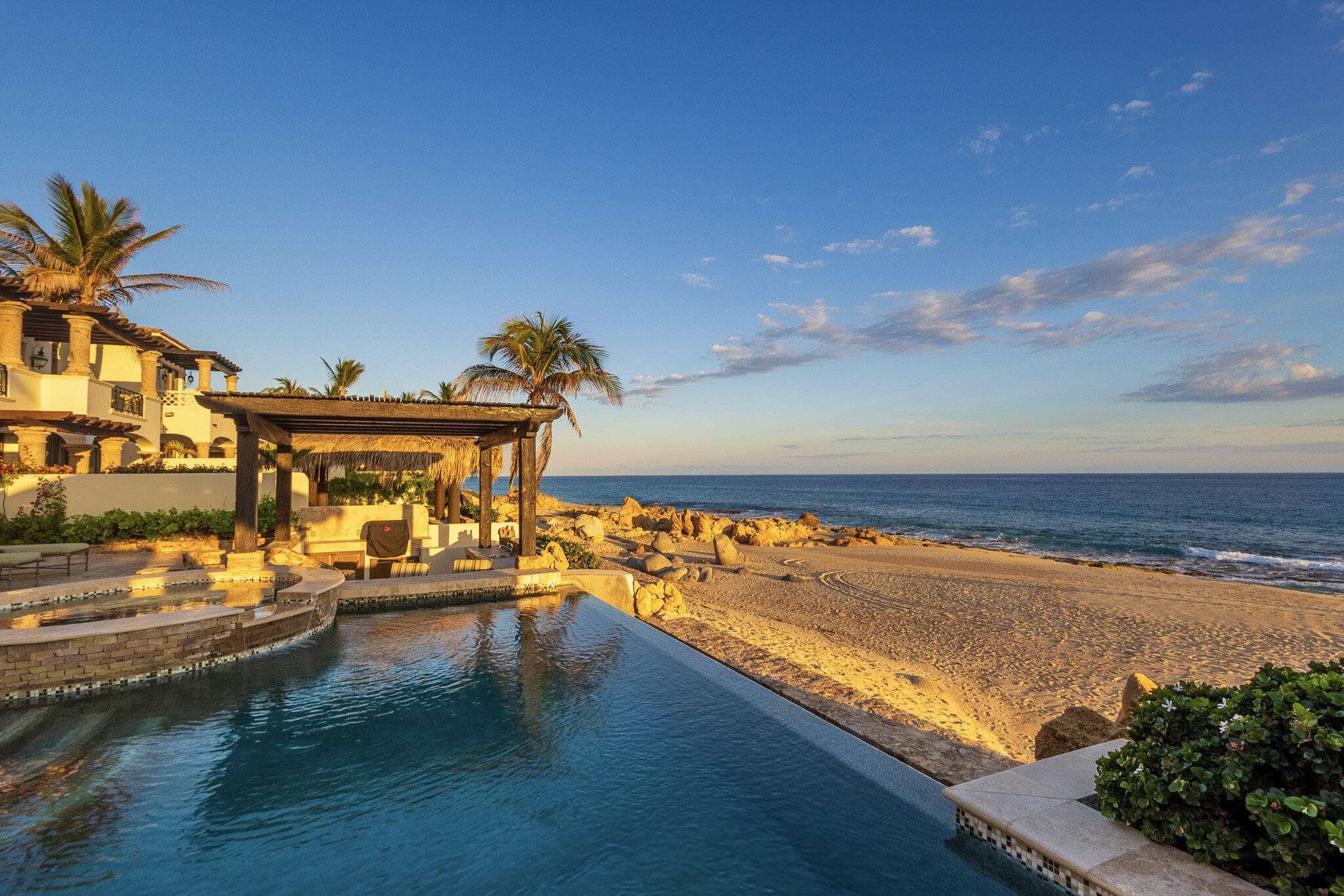 Cabo Luxury El Encanto Casa Cielo — Beachfront Hacienda Luxury in El Encanto de La LagunaCasa Cielo presents a rare opportunity to experience true beachfront living in the prestigious community of El Encanto de La Laguna. This 4-bedroom, 4-bathroom private villa blends timeless Hacienda architecture with refined, modern luxury finishes, all set on a pristine stretch of sand with panoramic ocean for sale