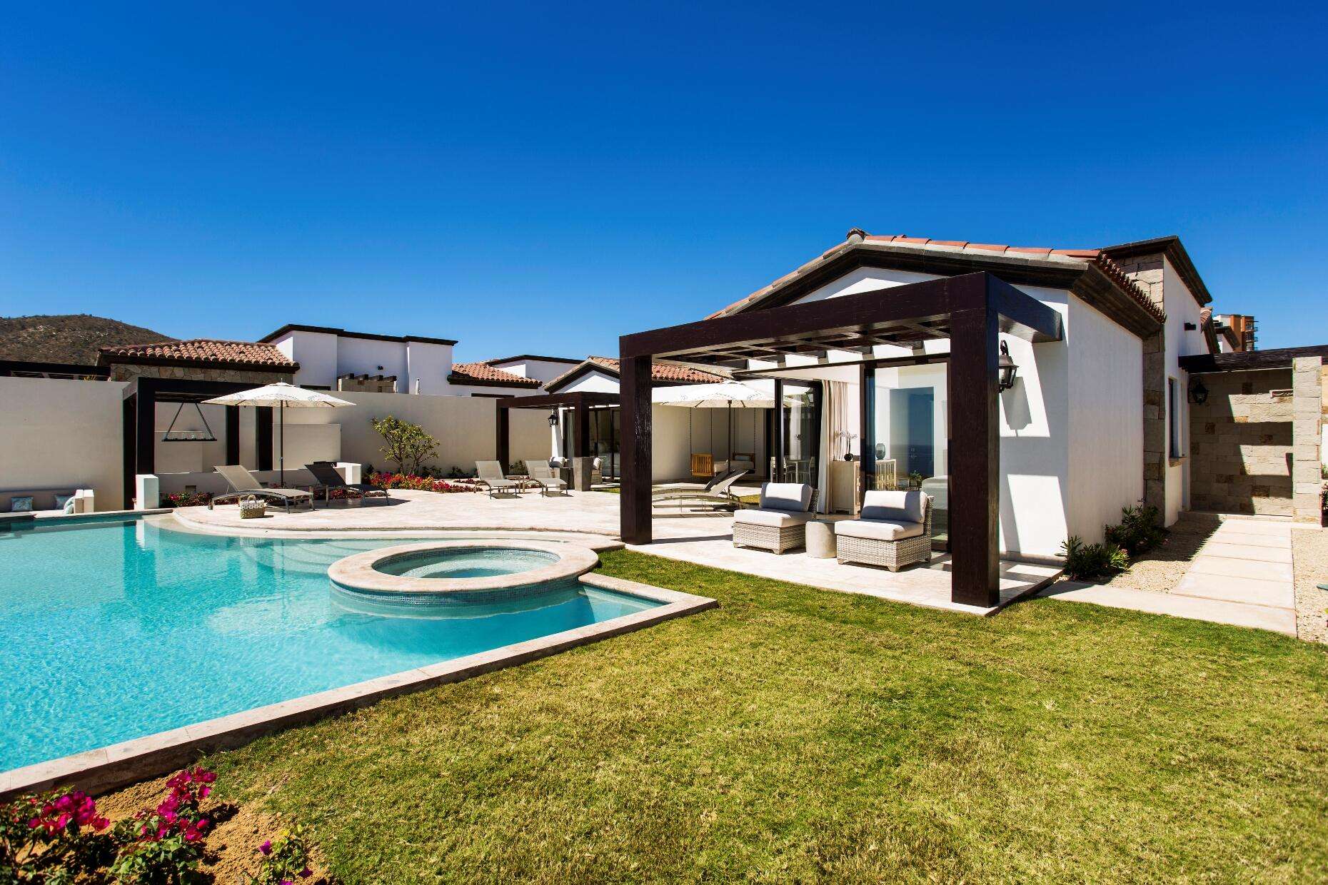 Cabo Luxury Coronado Espejo 4 bed home plan , this floorplan boasts a great room with vaulted ceilings over the living/dining/kitchen area which looks out over the large covered terrace and the hand-made infinity edge pool beyond. The chefs kitchen with huge island with seating boasts Wolf and Sub-Zero appliances. The master and guest master have large ensuite baths w/ shower and tubs, and also both have ocean for sale