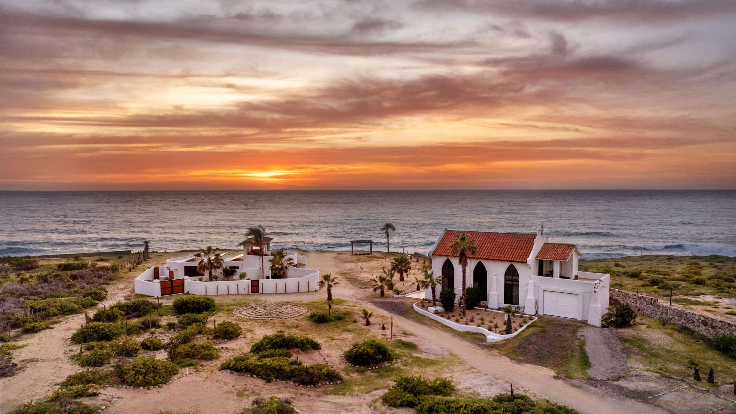 Cabo Luxury Elias Calles Welcome to Rancho 82 -- a rare 2.4-acre oceanfront property offering 190 feet of Pacific coastline, two charming Baja-style homes, and endless potential. With five titled lots, and easy access from Highway 19, this property could become a family compound, boutique retreat, or collection of oceanfront villas. The main home offers 3 bedrooms and 3 baths; the guest casita includes 3 bedrooms, 2 baths, and a rooftop terrace. Both feature authentic Mexican craftsmanship, handmade tiles, and sweeping ocean for sale