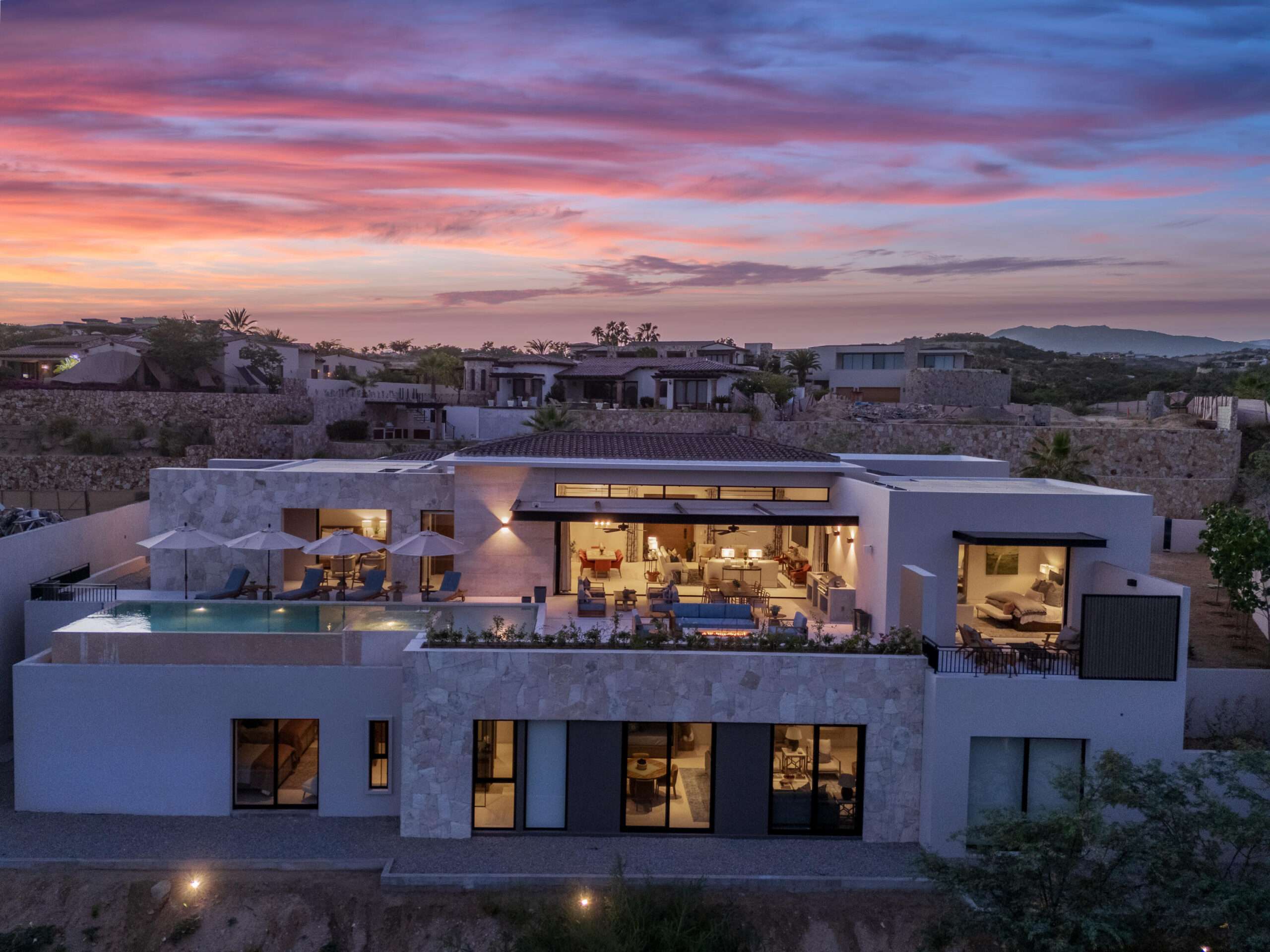 Cabo Luxury Section 18- Horizontes Welcome to Horizontes 3, an exquisite custom-made home located within San José del Cabo's most sought-after community, Querencia. Surrounded by Tom Fazio's signature golf course, recognized as one of the best in the country, this stunning residence is just a short golf cart ride from the prestigious 5-star Club House. This remarkable 6-bedroom, 6.5-bathroom home elevates luxury living with a fresh vision of architecture and design. The layout features a cozy family room, an expansive bunk bed bedroom on the lower level, and a spacious maid's quarters with an independent entrance, making it ideal for entertaining family and friends.The property boasts outdoor living spaces, including tranquil green areas, an outdoor kitchen, an infinity pool, a jacuzzi, and ocean and ravine – 3 Querencia, San Jose Corridor, BS